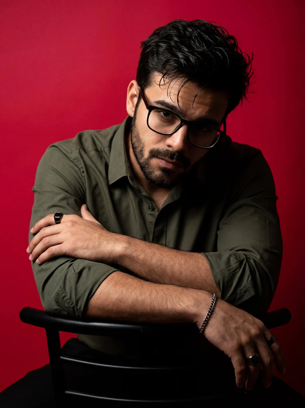 Red Backdrop and Olive Shirt